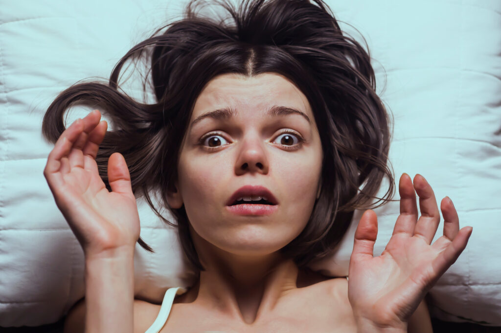 Young,Girl,With,A,Frightened,Expression,Wakes,Up,From,A